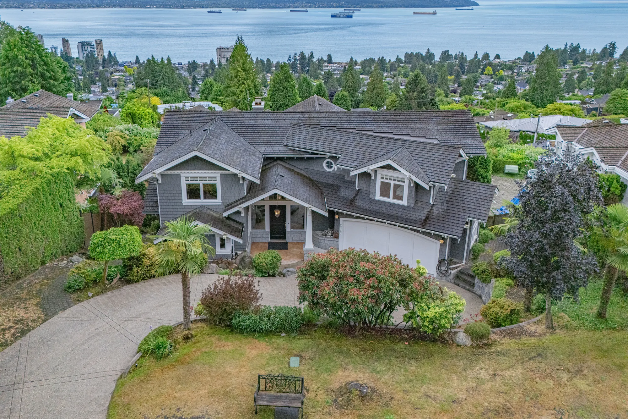 The front of the house from the air with the inlet and the far shore filling the background