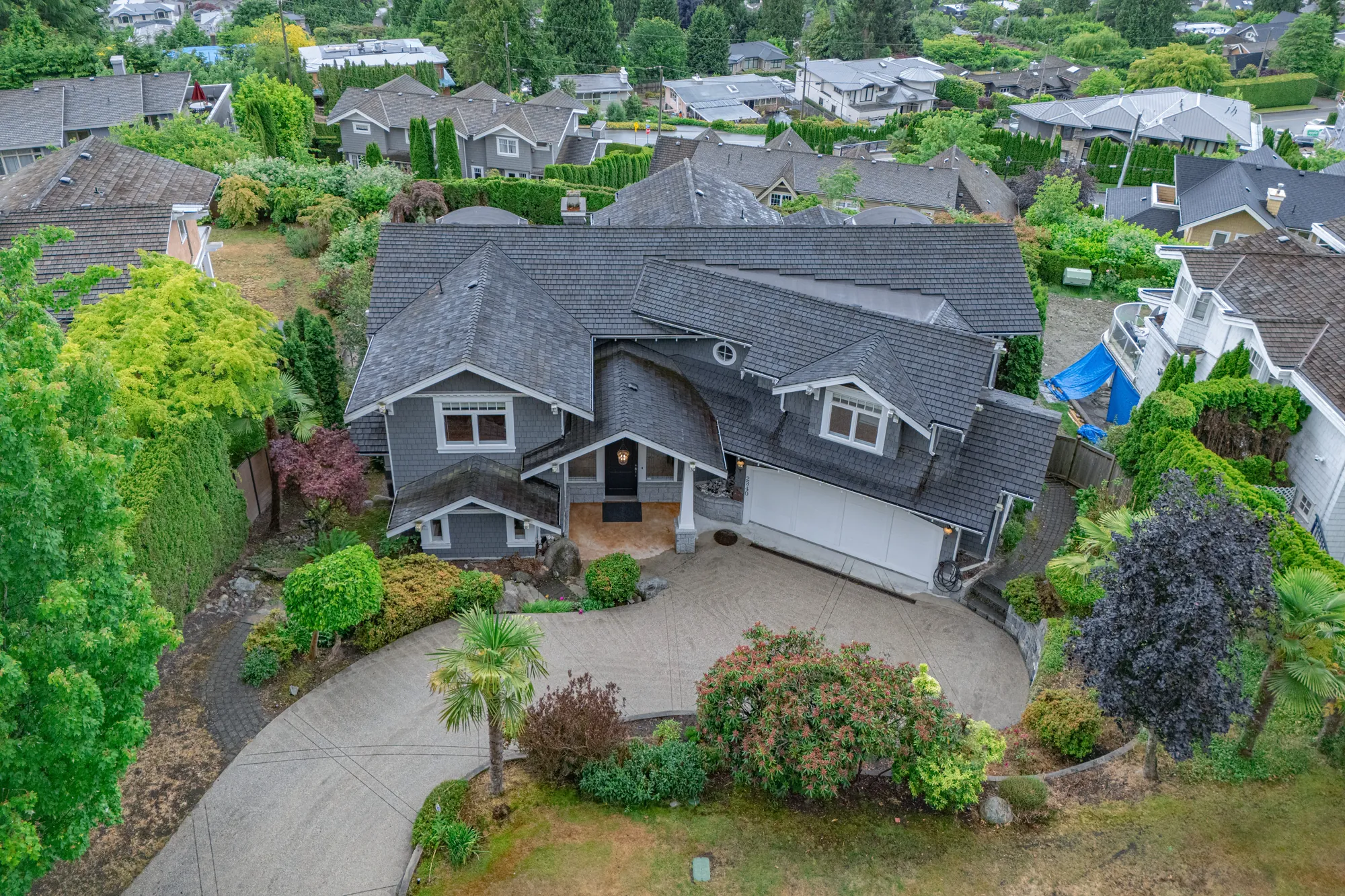 The house from above the lane, the turning circle and the roof of the neighbouring property
