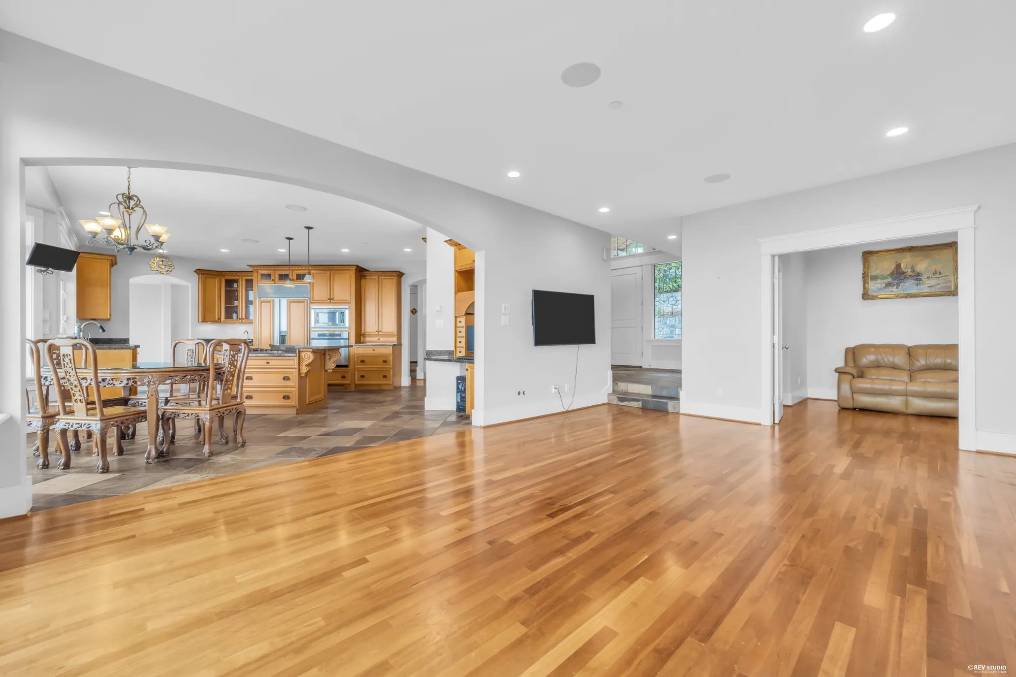 Looking across the family room to the kitchen and the breakfast area past it