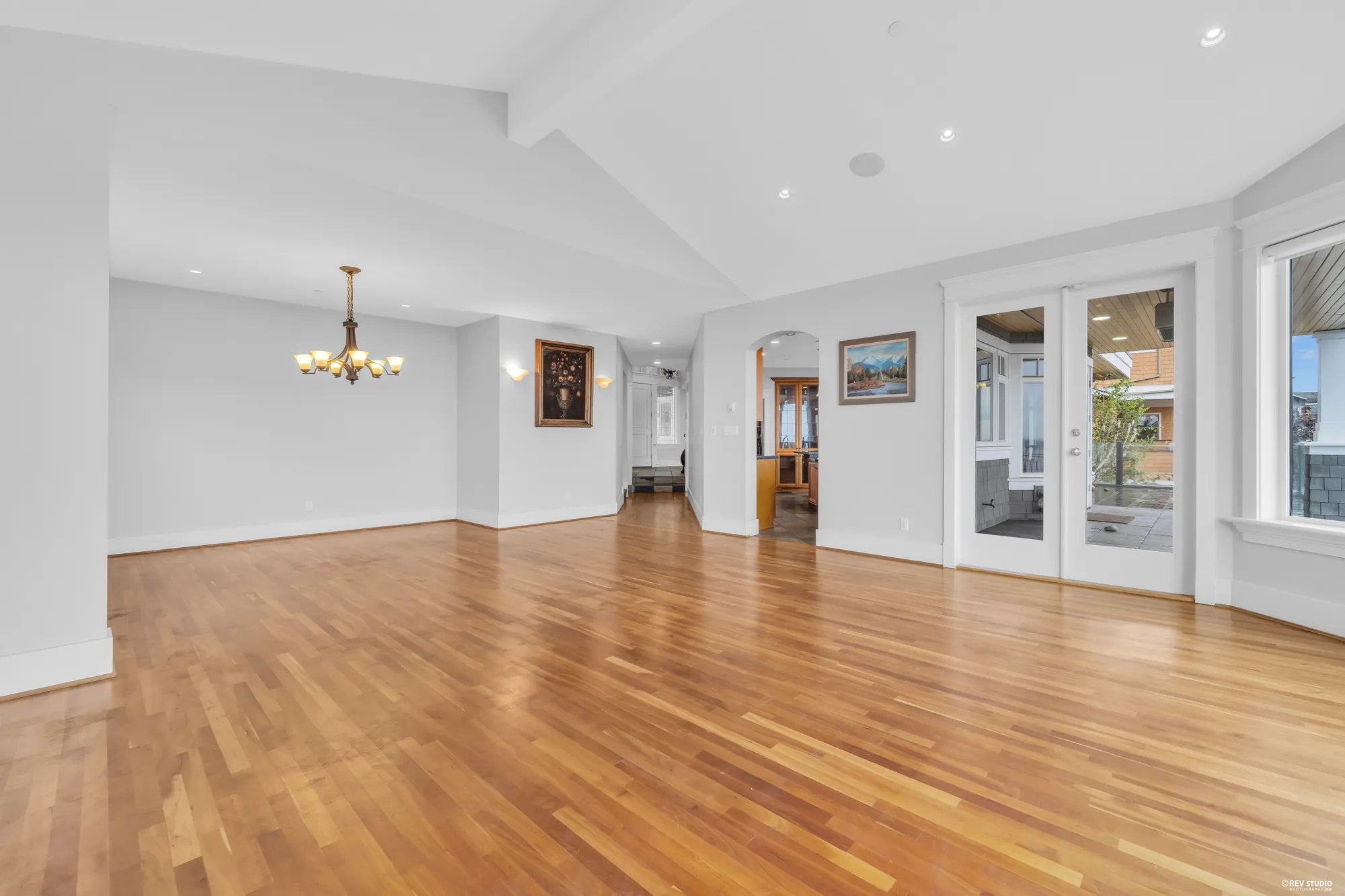 The main floor read end to end, the vaulted ceiling running the length of it