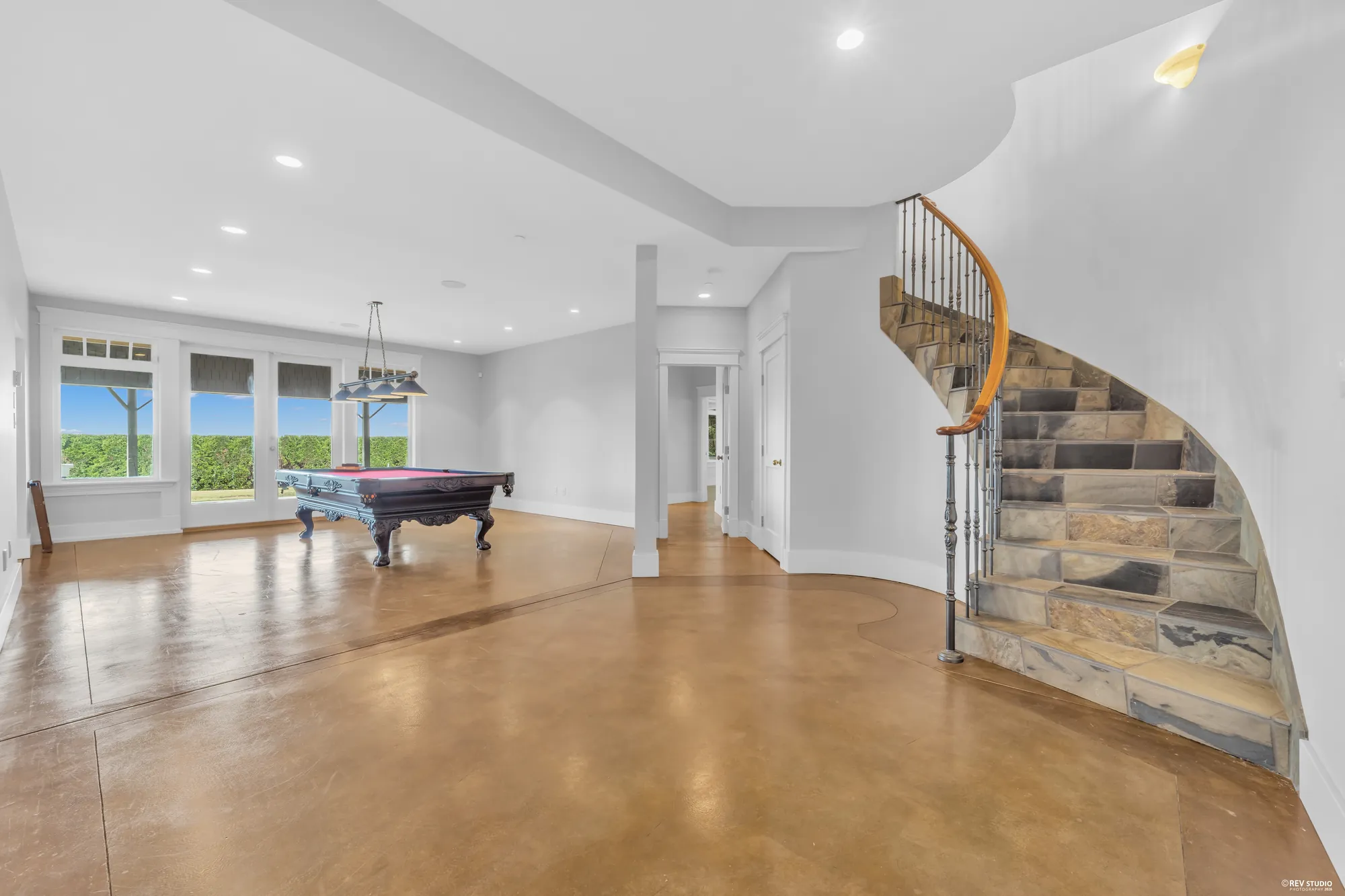 The recreation room from the other end with the stone-clad stair coming down into it