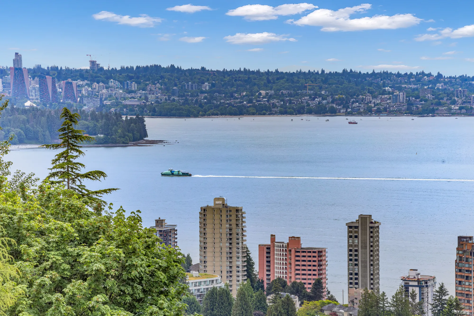 The West Vancouver shoreline in the foreground with the downtown towers and Burrard Inlet beyond